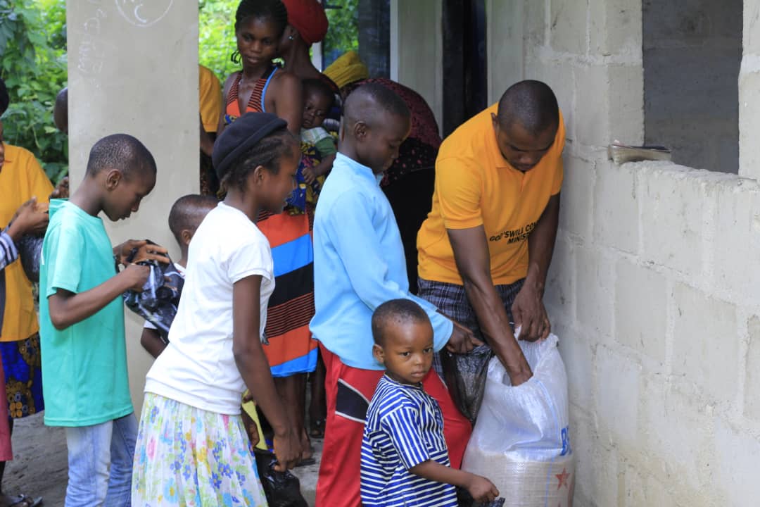 Children receiving supplies during outreach